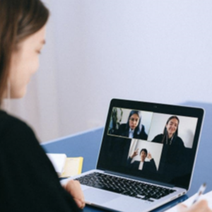 Hiring Remote Workers in Mexico: Expert Solutions. photograph of a woman on video call on a laptop