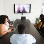 Foreign remote workers in a virtual meeting with the hiring organization - Discover the easy guide to hiring remote workers in foreign countries.