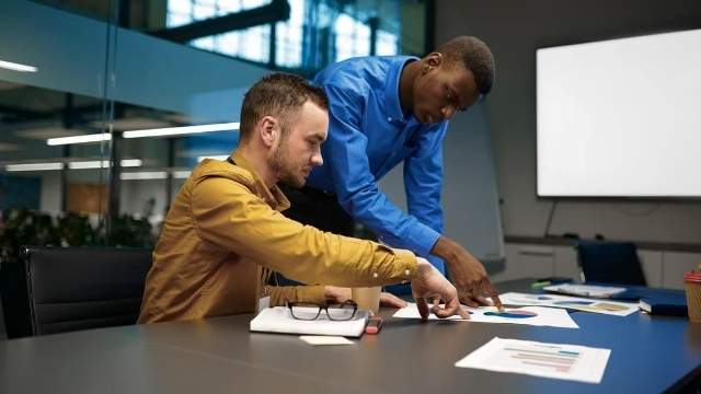 team of managers discussion in it business office